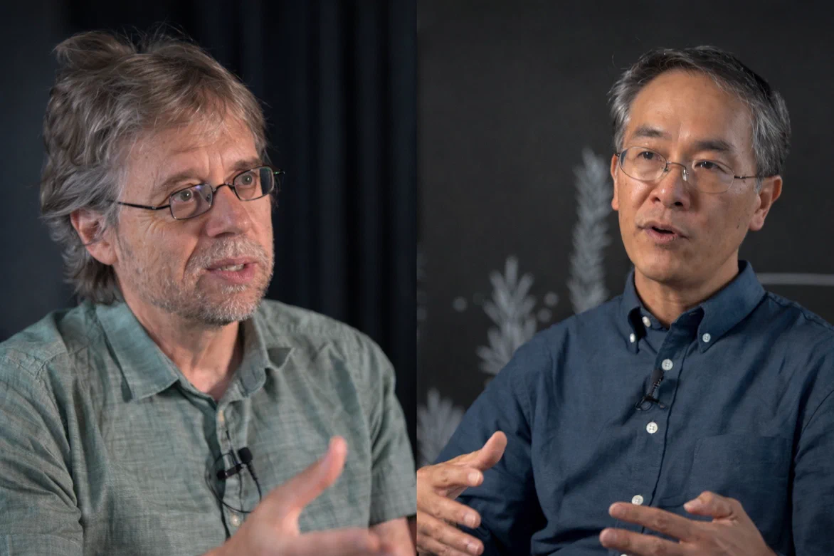 Two people talking on a podcast